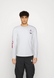 Лонгслів Jordan Flight Team Men&rsquo;s Long-Sleeve T-Shirt &lsquo;White/Red&rsquo; S DH8944-100